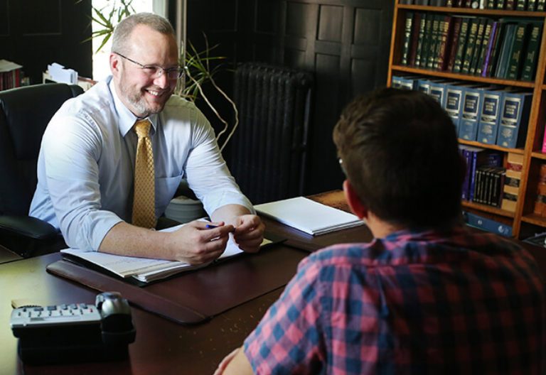 Smiling attorney during consultation with a client